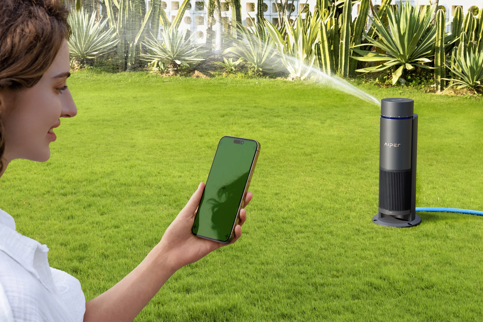 Woman using smartphone app to control Aiper IrriSense 2 lawn sprinkler
